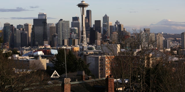 The Space Needle and Mount Rainier in Seattle's skyline.