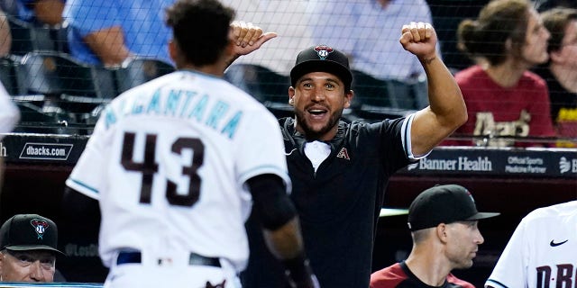 Arizona Diamondbacks' Sergio Alcantara (43) celebrates his two-run home run against the San Francisco Giants with Diamondbacks' David Peralta during the second inning of a baseball game Tuesday, July 26, 2022, in Phoenix.