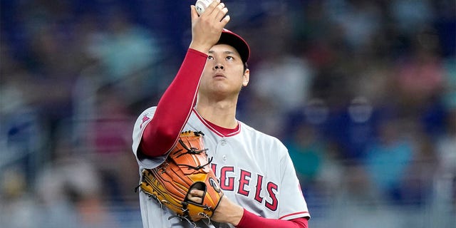 Los Angeles Angels starting pitcher Shohei Ohtani prepares to throw during the first inning of the team's baseball game against the Miami Marlins, Wednesday, July 6, 2022, in Miami. 