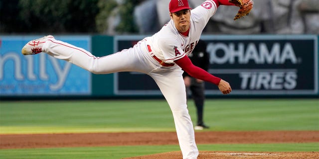 Los Angeles Angels starting pitcher Shohei Ohtani throws to the plate during the first inning of a baseball game against the Houston Astros Wednesday, July 13, 2022, in Anaheim, Calif.