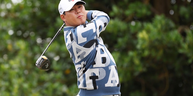 Si Woo Kim of South Korea tees off on the 3rd hole during Day One of The 150th Open at St Andrews Old Course on July 14, 2022, in St Andrews, Scotland.