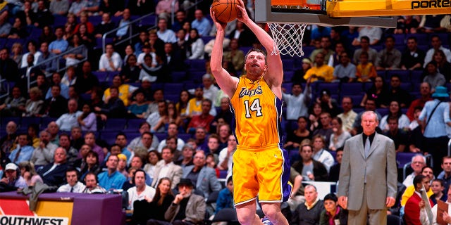 Stanislav Medvedenko, #14 of the Los Angeles Lakers, goes up for a shot against the Vancouver Grizzlies at the Staples Center on Jan. 15, 2001.