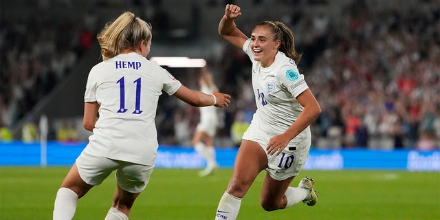 England's Georgia Stanway, right, celebrates with Lauren Hemp after scoring her side's second goal during the Women Euro 2022 quarter final soccer match between England and Spain at the Falmer stadium in Brighton, Wednesday, July 20, 2022. 