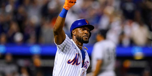 New York Mets' Starling Marte celebrates after hitting a an RBI single during the ninth inning of the team's baseball game against the New York Yankees on Wednesday, July 27, 2022, in New York. The Mets won 3-2.