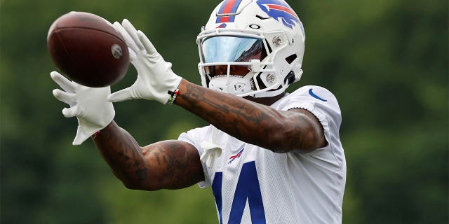Buffalo Bills receiver Stefon Diggs (14) makes a catch during practice at the NFL football team's training camp in Pittsford, N.Y., Sunday July 24, 2022.