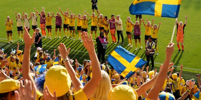 Sweden players celebrate with the fans at the end of the Women Euro 2022 group C soccer match between Sweden and Portugal at Leigh Sports Village, in Leigh, Manchester, England, Sunday, July 17, 2022. Sweden won 5-0 to advance to the quarterfinals.