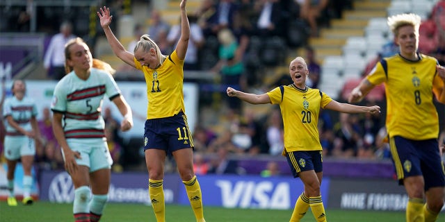 Sweden's Stina Blackstenius, center left, reacts after scoring her side's fifth goal during the Women Euro 2022 group C soccer match between Sweden and Portugal at Leigh Sports Village, in Leigh, Manchester, England, Sunday, July 17, 2022.
