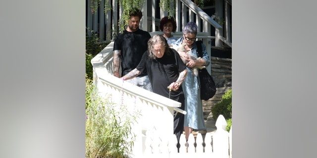 Ozzy Osbourne made his way down a flight of stairs with his wife Sharon, son Jack and pregnant daughter Kelly following closely behind him.