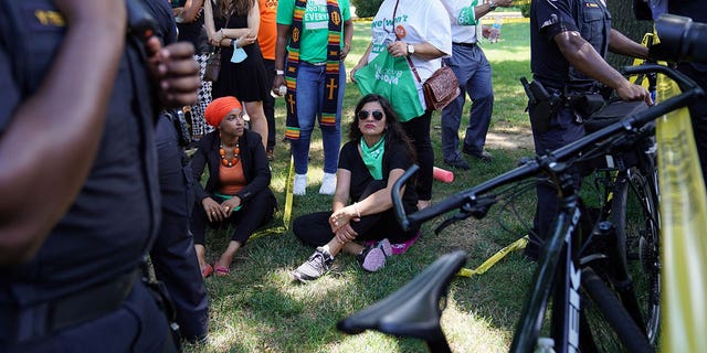 Representatives Ilhan Omar (D-MN) and Rashida Tlaib (D-MI) are detained for their part in an abortion rights protest outside of the U.S. Supreme Court in Washington, D.C., U.S., July 19, 2022. 