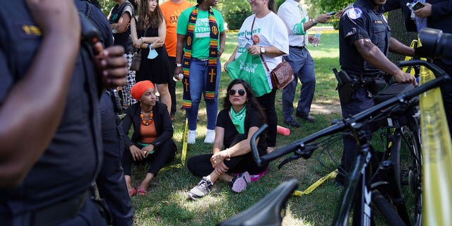 Representatives Ilhan Omar (D-MN) and Rashida Tlaib (D-MI) are detained for their part in an abortion rights protest outside of the U.S. Supreme Court in Washington, D.C., U.S., July 19, 2022. 