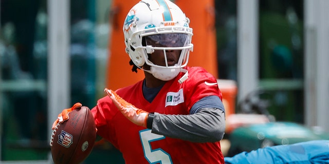 Teddy Bridgewater, #5 of the Miami Dolphins, throws the ball during the Miami Dolphins OTAs at the Baptist Health Training Complex on May 24, 2022 in Miami Gardens, Florida.