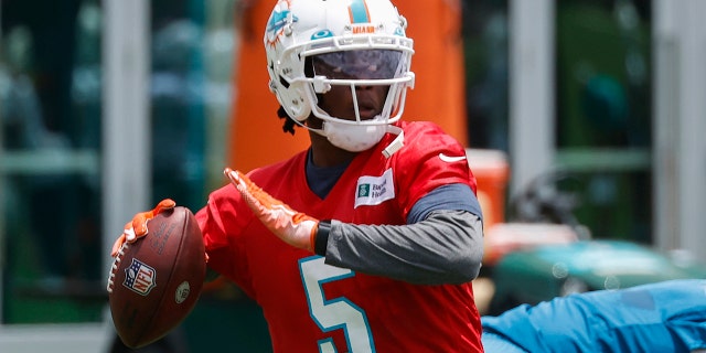 Teddy Bridgewater, #5 of the Miami Dolphins, throws the ball during the Miami Dolphins OTAs at the Baptist Health Training Complex on May 24, 2022 in Miami Gardens, Florida.