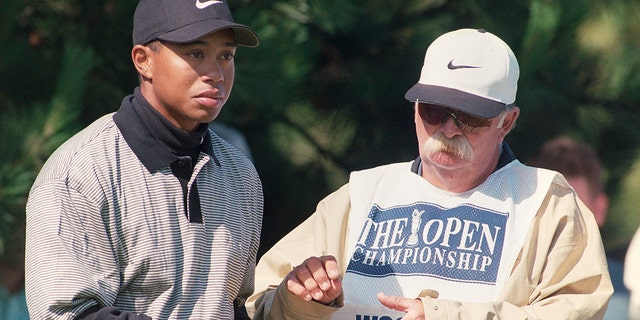 Tiger Woods with his caddy Mike "fluff" Cowan during the 127th British Open of Golf at the Royal Birkdale GC in Southport on July 16-19 1998.