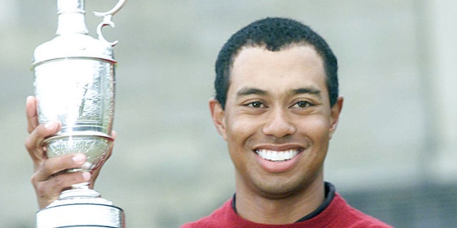 Tiger Woods with the famous Claret Jug after victory at the Open Championship.