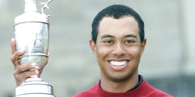 Tiger Woods with the famous Claret Jug after victory at the Open Championship.