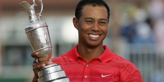 Tiger Woods of USA poses with the claret jug following his two shot victory at the end of the final round of The Open Championship at Royal Liverpool Golf Club on July 23, 2006 in Hoylake, England.