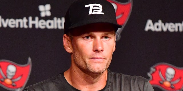 Tom Brady, #12 of Tampa Bay Buccaneers, answers questions at a press conference following the 2022 Buccaneers minicamp at AdventHealth Training Center on June 09, 2022 in Tampa, Florida.