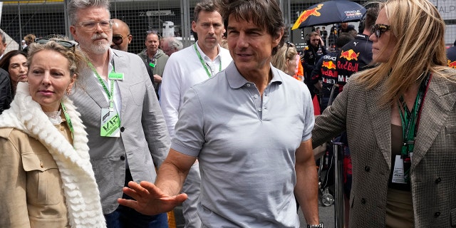 Tom Cruise is on the grid before the British Formula One Grand Prix at the Silverstone circuit, in Silverstone, England, Sunday, July 3, 2022. 