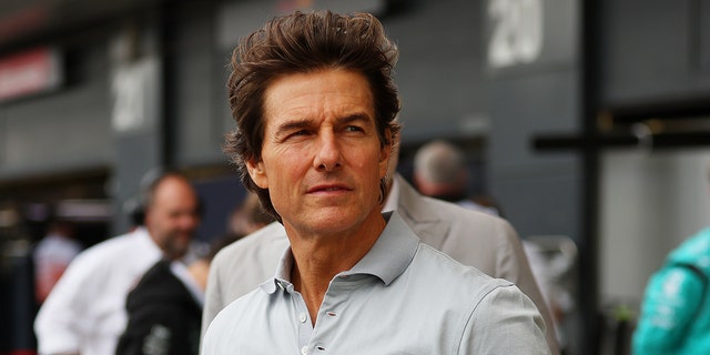 Tom Cruise looks on in the pit lane before the F1 Grand Prix of Great Britain at Silverstone on July 03, 2022 in Northampton, England.