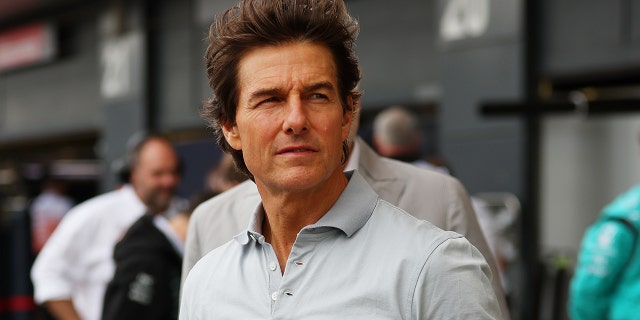 Tom Cruise looks on in the pit lane before the F1 Grand Prix of Great Britain at Silverstone on July 03, 2022 in Northampton, England.