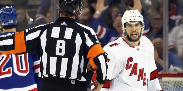 Tony DeAngelo of the Carolina Hurricanes argues a call with referee Francois St. Laurent in Game 6 of the second round of the 2022 Stanley Cup playoffs against the Rangers at Madison Square Garden May 28, 2022, in New York City.