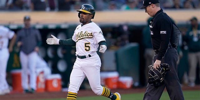 Oakland Athletics' Tony Kemp (5) reacts after hitting a home run against the Houston Astros during the third inning of a baseball game in Oakland, Calif., Monday, July 25, 2022.