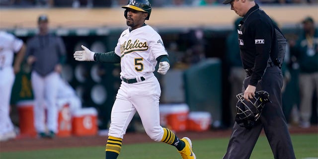 Oakland Athletics' Tony Kemp (5) reacts after hitting a home run against the Houston Astros during the third inning of a baseball game in Oakland, Calif., Monday, July 25, 2022.