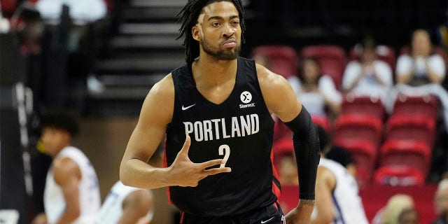 Portland Trail Blazers' Trendon Watford celebrates after making a 3-point shot against the New York Knicks during the first half an NBA summer league championship basketball game Sunday, July 17, 2022, in Las Vegas.