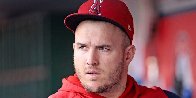 Mike Trout, #27 of the Los Angeles Angels, looks on in the dugout prior to the game against the New York Mets at Angel Stadium of Anaheim on June 10, 2022 in Anaheim, California.