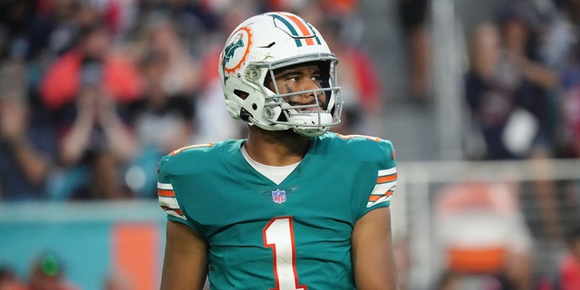 Tua Tagovailoa of the Miami Dolphins in action against the New England Patriots at Hard Rock Stadium on January 9, 2022 in Miami Gardens, Fla.