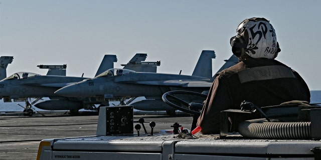 F/A-18 Hornet fighter jets are stationed on the deck of the US Nimitz-class nuclear-powered aircraft carrier USS Harry S. Truman, during a NATO vigilance activity NEPTUNE SHIELD 2022 (NESH22) on eastern Mediterranean Sea on May 23, 2022.