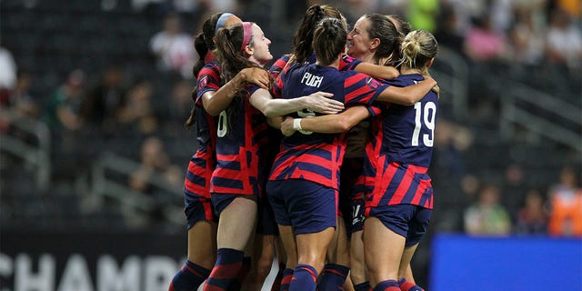 United States' Alex Morgan is congratulated after scoring her side's opening goal from the penalty spot against Canada during the CONCACAF Women's Championship final soccer match in Monterrey, Mexico, Monday, July 18, 2022. 
