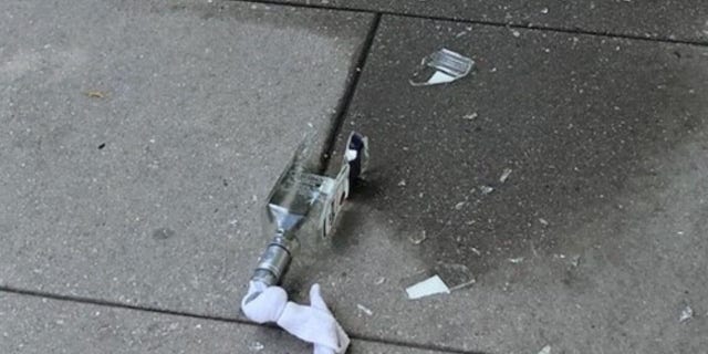 The suspect allegedly threw an unlit Molotov cocktail at officers before he was arrested.