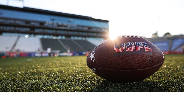 The USFL logo on a football during warmups before a game between the New Orleans Breakers and Michigan Panthers at Protective Stadium May 28, 2022, in Birmingham, Ala.