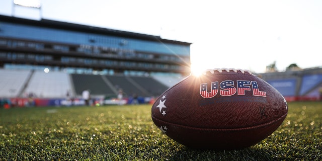 The USFL logo on a football during warmups before a game between the New Orleans Breakers and Michigan Panthers at Protective Stadium May 28, 2022, in Birmingham, Ala.