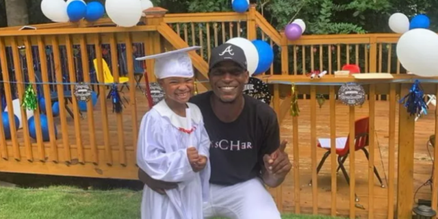 Police say that Bradley Coleman, 29, was attempting to stop someone from stealing his car when he was shot and killed. He is pictured with his child.