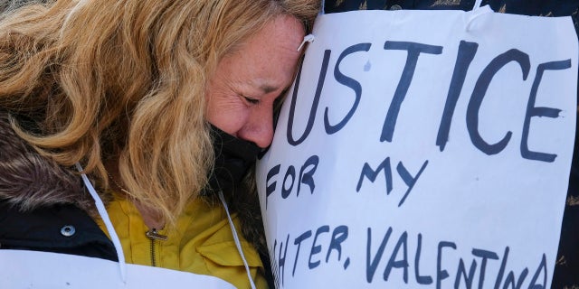 FILE - Soledad Peralta, mother of Valentina Orellana Peralta, cries at a news conference outside Los Angeles Police Department Headquarters in Los Angeles, on Dec. 28, 2021. The parents of Valentina Orellana Peralta, a 14-year-old girl killed by Los Angeles police in a clothing store last year, have filed a lawsuit against the department and the officer whose rifle round pierced a dressing room wall. Peralta and her mother were shopping for Christmas clothes on Dec. 23 at a Burlington store in the San Fernando Valley's North Hollywood neighborhood. (AP Photo/Ringo H.W. Chiu, File)