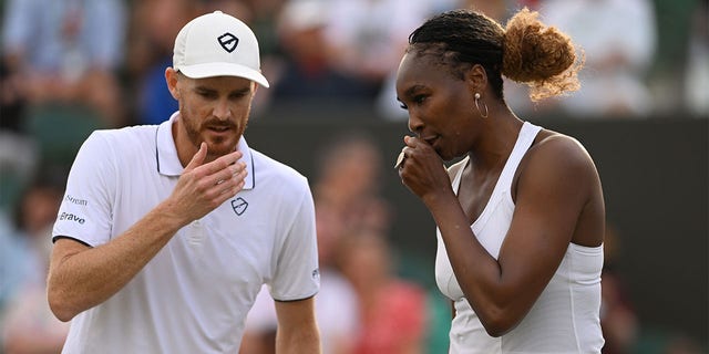 Venus Williams of The United States and partner Jamie Murray of Great Britain interact during their Mixed Doubles Second Round match against Alicia Barnett of Great Britain and Jonny O'Mara of Great Britain on day seven of The Championships Wimbledon 2022 at All England Lawn Tennis and Croquet Club on July 03, 2022 in London, England. 