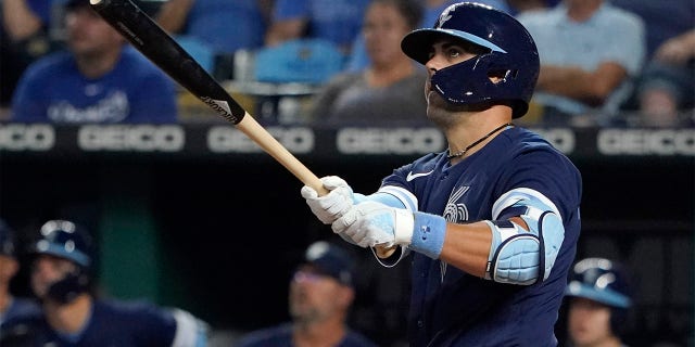 Whit Merrifield #15 of the Kansas City Royals hits a two-run home run in the eighth inning against the Cleveland Guardians at Kauffman Stadium on July 08, 2022 in Kansas City, Missouri.