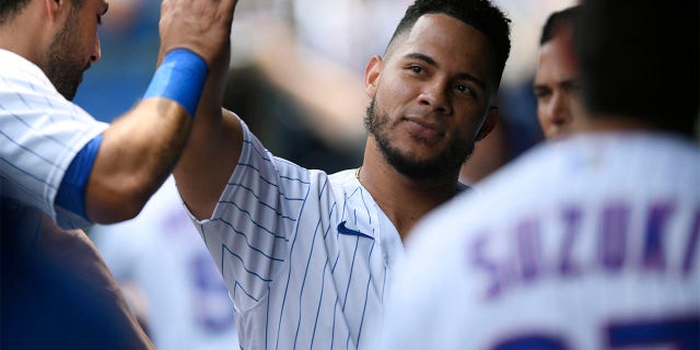 Cubs' Willson Contreras celebrates with teammates after scoring on a two RBI double by Ian Happ against the Pittsburgh Pirates Tuesday, July 26, 2022, in Chicago.
