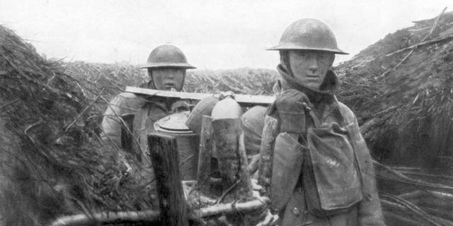 American troops at the World War I front deliver soup to their comrades, 1917-1918. World War I veteran Edward Bullard was inspired by doughboy steel helmets to invent the first construction hard hat in 1919.