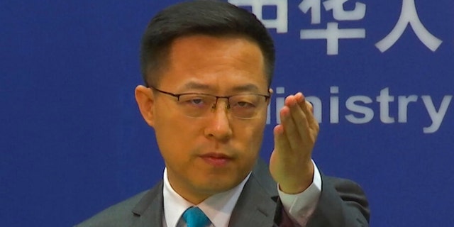 Chinese Foreign Ministry spokesperson Zhao Lijian gestures during a press conference at the Ministry of Foreign Affairs in Beijing July 6, 2022. 