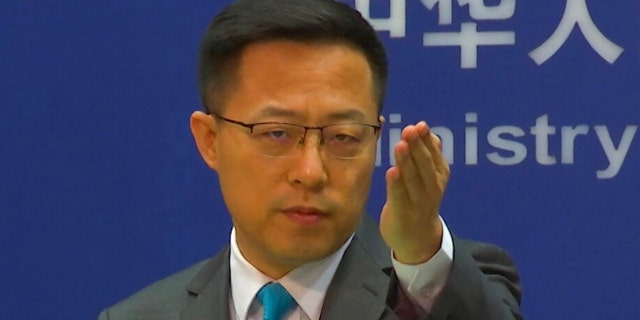 Chinese Foreign Ministry spokesperson Zhao Lijian gestures during a press conference at the Ministry of Foreign Affairs in Beijing July 6, 2022. 