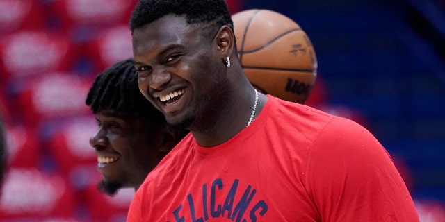 FILE - New Orleans Pelicans forward Zion Williamson watches a shoot-around before Game 6 of the team's NBA basketball first-round playoff series against the Phoenix Suns, April 29, 2022, in New Orleans.