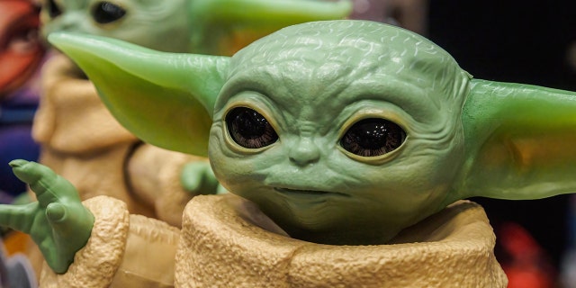 A figure of the main character from the popular TV series. "mandalorian" Grogu (Baby Yoda) seen in a store.