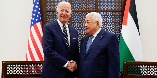 Palestinian President Mahmoud Abbas and U.S. President Joe Biden shake hands in the West Bank town of Bethlehem. (AP Photo/Evan Vucci)