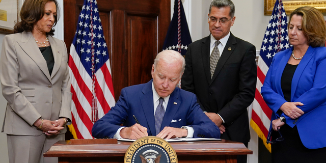 President Joe Biden signs an executive order on abortion access during an event in the Roosevelt Room of the White House, Friday, July 8, 2022, in Washington.