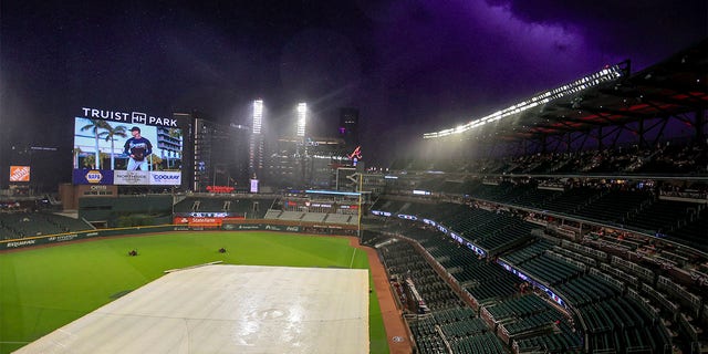Play has been halted due to a weather delay in the fifth inning of a baseball game between the Atlanta Braves and the St. Louis Cardinals on Monday, July 4, 2022 in Atlanta. 