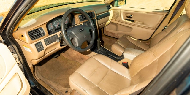 The V70 is dark blue with a tan interior.