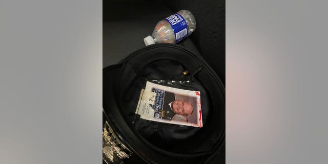 A photo shows a bullet lodged in the blood stained hat worn by a Philadelphia police officer who was shot in the head on July 4, 2022.